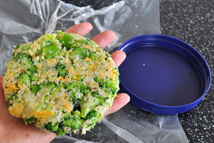 Round shaped broccoli patty ready for baking.
